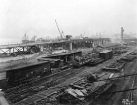 [Progress photograph of the construction and lumber yard for the CPR Pier "B/C" superst...