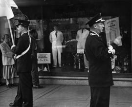 [Jack Wilkinson, bandmaster and other firefighters in front of Fire Prevention Week display at Hu...