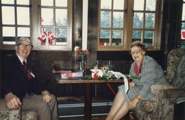 Man and woman indoors at Brockton Clubhouse during Canada Day Festival