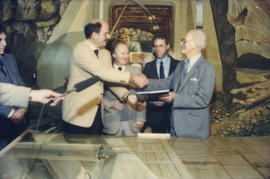 Mike Harcourt, Ferdinand Petrov, unidentified man and Fraser Wilson in front of mural