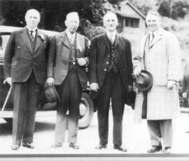 [Group portrait of four men] upon the 50th anniversary of the arrival of the first transcontinent...