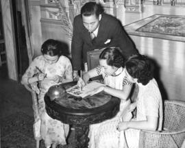 [Young women practice calligraphy]