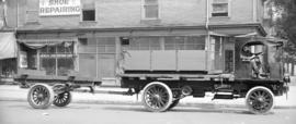 [A truck in front of Georgia Shoe Repair Shop 509 West Georgia Street]