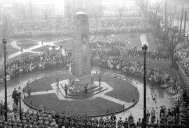 [View of crowds and military personnel around cenotaph at Victory Square]