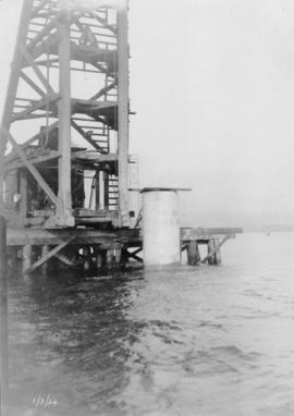 Close-up of pier and pile driver : March 1, 1924