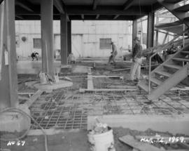 Construction of new melting house: view of interior, pouring concrete floor