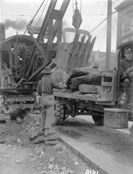 [Men excavating street with Thew Automatic Shovel, for reconstruction of streetcar lines at Hasti...