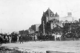 [Horse drawn carriages awaiting passengers behind C.P.R. Station]