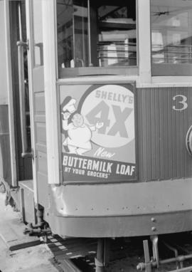 Shelly's [Bakery] buttermilk loaf [advertisement on train car] Stewart-McIntosh [Ltd. Ad. Agency ...