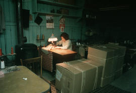 Seamstress working at Wing Hing Dry Goods