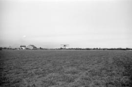 [View of biplane in flight]