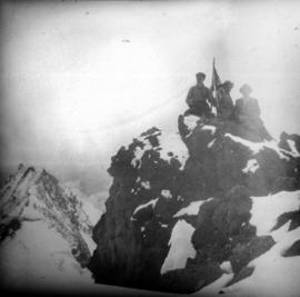 [Men on summit of unidentified mountain]