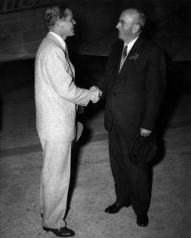 Charles E. Thompson and Dan Duryea at airport