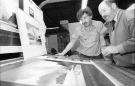 Unidentified man and Toni Onley examine his Centennial Art Series Print at Agency Press