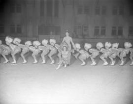 [Group of skaters in First Nations costumes at the Rotary Ice Carnival]