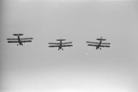 [Bi-planes in flight at airshow]