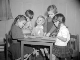 [Children playing with clay at the Preparatory School for Little Children]