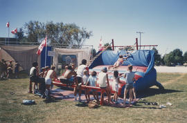 Children on inflatable sports equipment as part of the Sports Action Program