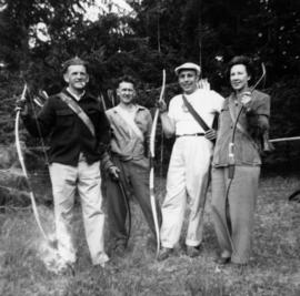 Group photograph of four Greenwood Archers members [in Stanley Park]