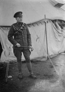 [Soldier in front of a tent]