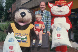Tillicum and MacTavish with a child and Mayor Harcourt