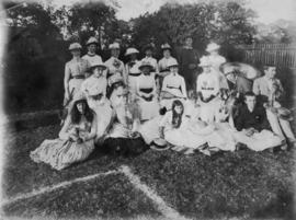 Group in garden with tennis rackets