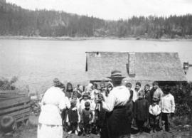 [Mrs. Robert Donley and Mrs. Watkins taking photographs of school children]