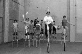 Stilt and unicycle routine rehearsal