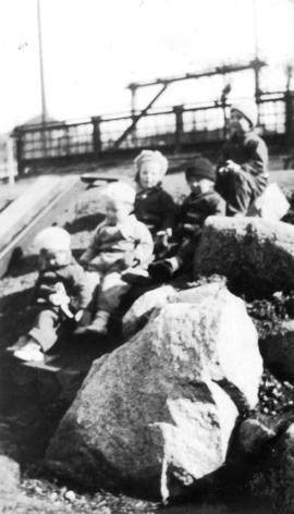 Children sitting on hill