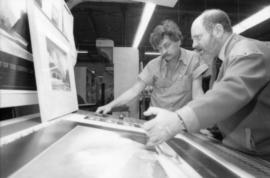 Unidentified man and Toni Onley examine his Centennial Art Series Print at Agency Press