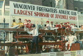[Fire engine with representatives from juvenile sports teams sponsored by Vancouver Firefighters'...