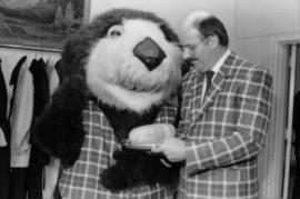 Tillicum and Mike Harcourt holding haggis