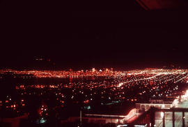 [Night view of the West End and] downtown from Broadway at Stephens