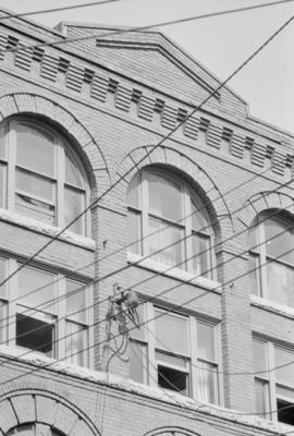 [Detail of upper level pilasters, windows and cornices at 321 Water Street]