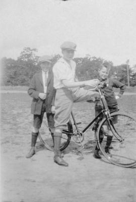 Three boys and a bicycle