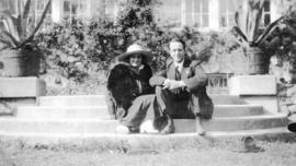 [Couple sitting on steps at Stanley Park Pavilion]