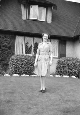 [Full length portrait of Miss Marcia Dietrich on the front lawn of her home]