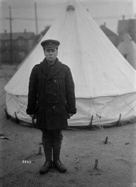 [Man in military uniform in camp]