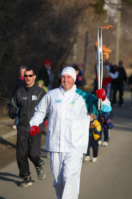 Day 90 Torchbearer 80 Todd Woon carries the flame in Chase, British Columbia