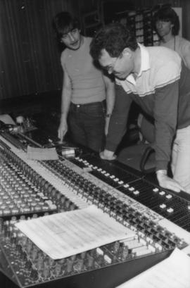 Group behind mixing boards at Griffiths Gibson Productions