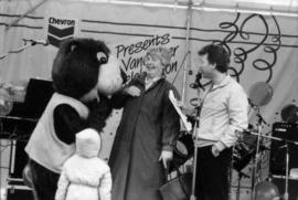 Child, Tillicum, unidentified woman and man on stage