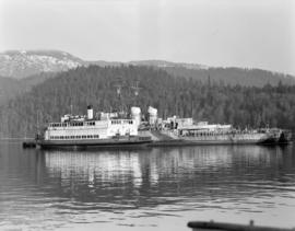 [Boats and barges tied up together in Vancouver harbour]