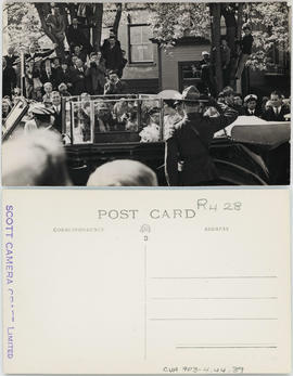 King George VI and Queen Elizabeth being conveyed in an automobile