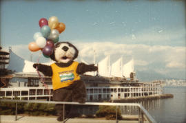 Tillicum holding balloons in front of Canada Place