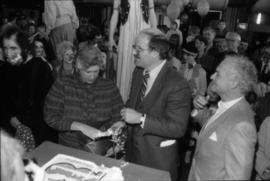 Pat Carney and Mike Harcourt cut cake