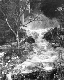 [A torrent of flood water hitting the McGowen home at 3262 Marine Drive]