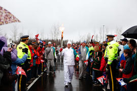 New Day 30 Torchbearer 70 Scott Toner carries the flame inot Grand-Sault/Grand Falls Community Ce...