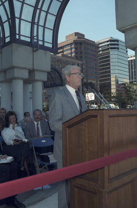 Unidentified man speaking at Portal Park opening