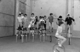 Stilt and unicycle routine rehearsal
