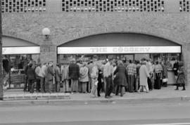 Crowd outside the Coggery, 130 Water Street, from across the street